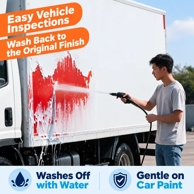 Temporary coating being rinsed from a truck side panel