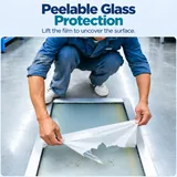 Protective film peeled from a framed glass panel