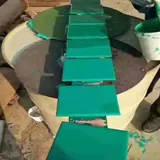 Rectangular coated test panels arranged in a row