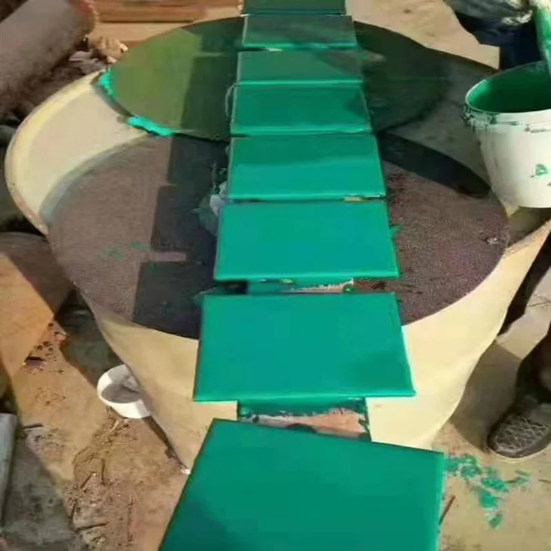 Rectangular coated test panels arranged in a row