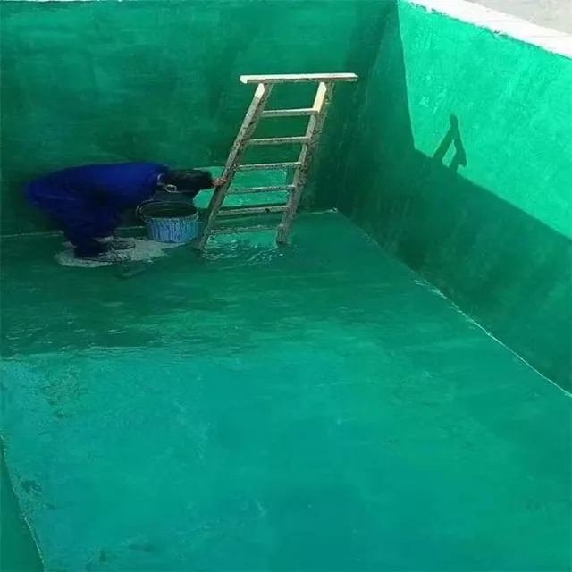Worker applying green lining inside a tank
