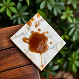 Brown liquid on a marble sample
