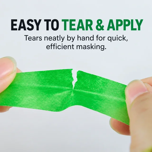 Low-tack paper masking tape being torn by hand