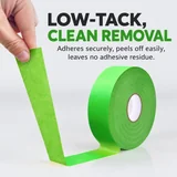 Low-tack tape being lifted from a smooth surface